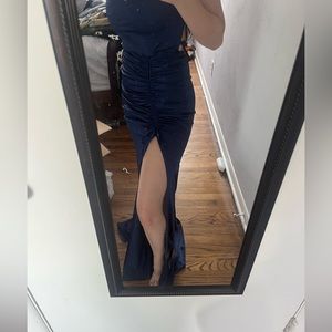 This is a full length navy blue formal dress